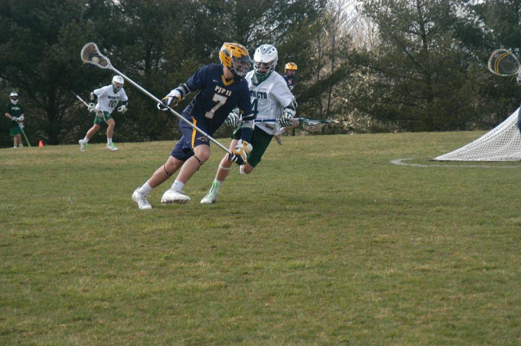 Soph. Attackman Keith White tries to take the ball from a PJP defenseman.