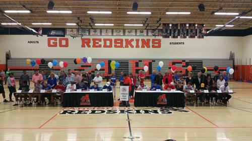 Our 15 student athletes singing their National Letters of Intent