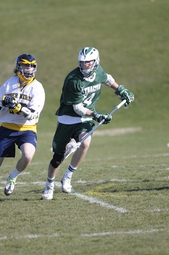 Scott Markle guards UM's Trevor Kupecky.  Markle led the team in both caused turnovers (3) and ground balls (5).